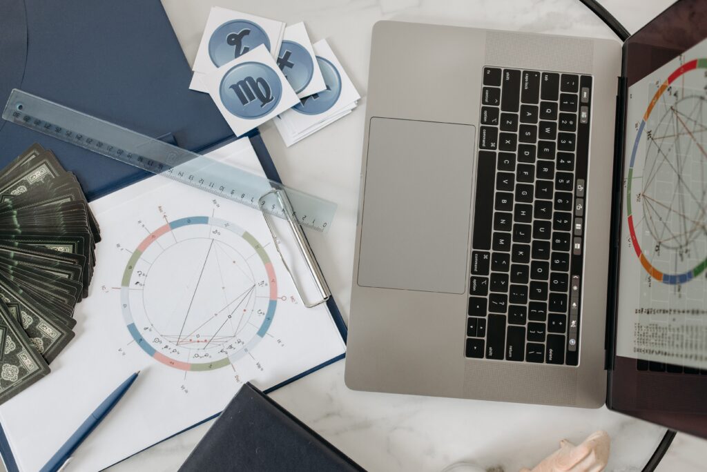 computer, astrology chart, cards, journal